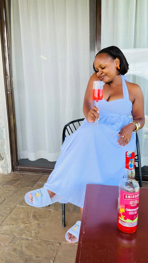 Instagram post by @anne.atuti for Smirnoff. Caption reads: [...] I absolutely enjoy the cosmopolitan by....