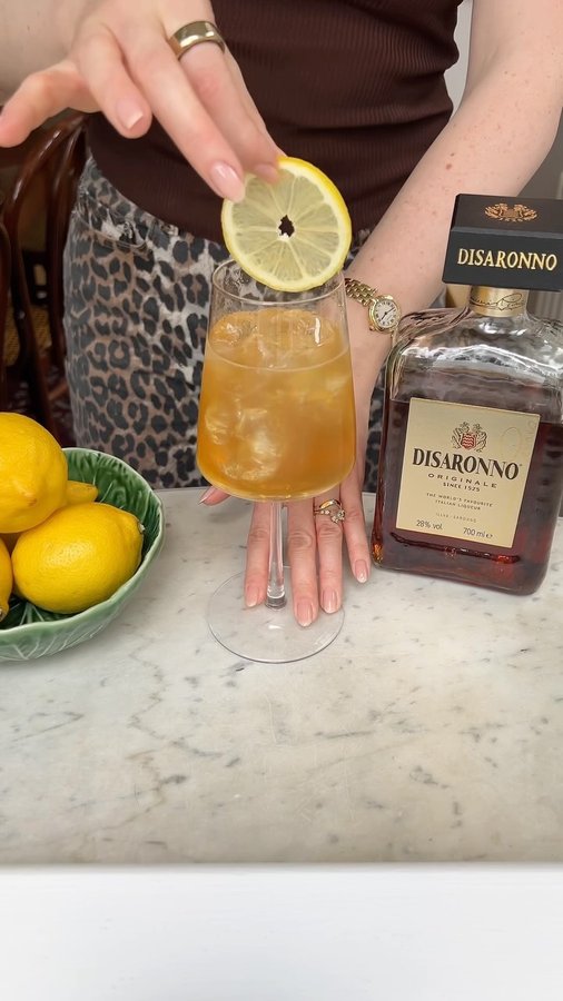 Instagram post by @alanalav for Disaronno. Caption reads: Aperitivo hour ft. a @disaronno_official spritz +....