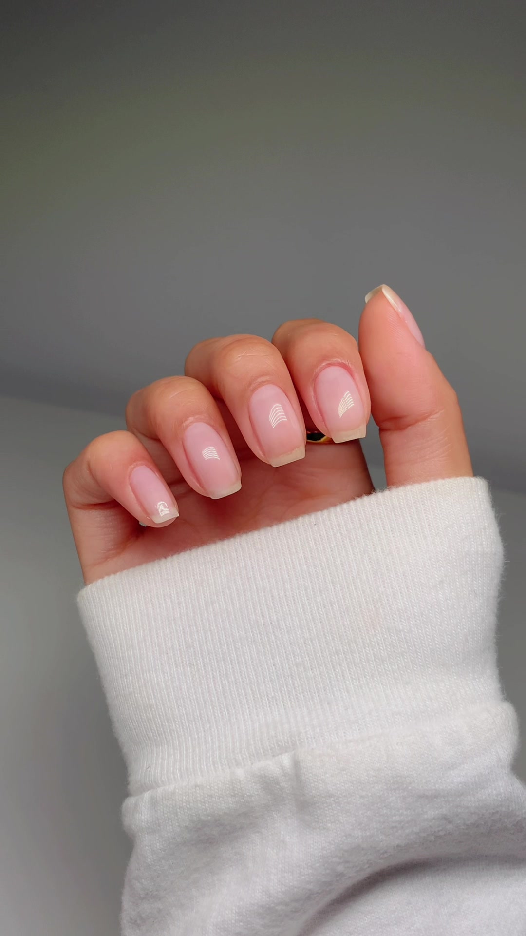 TikTok post by @glossytipped for Olive & June. Caption reads: Back to square one, but I can’t wait to have long....