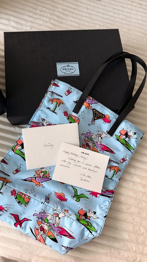 Instagram post by @emilychaho for Prada. Caption reads: Holiday magic, courtesy of Prada 🤍

#PradaHoliday.