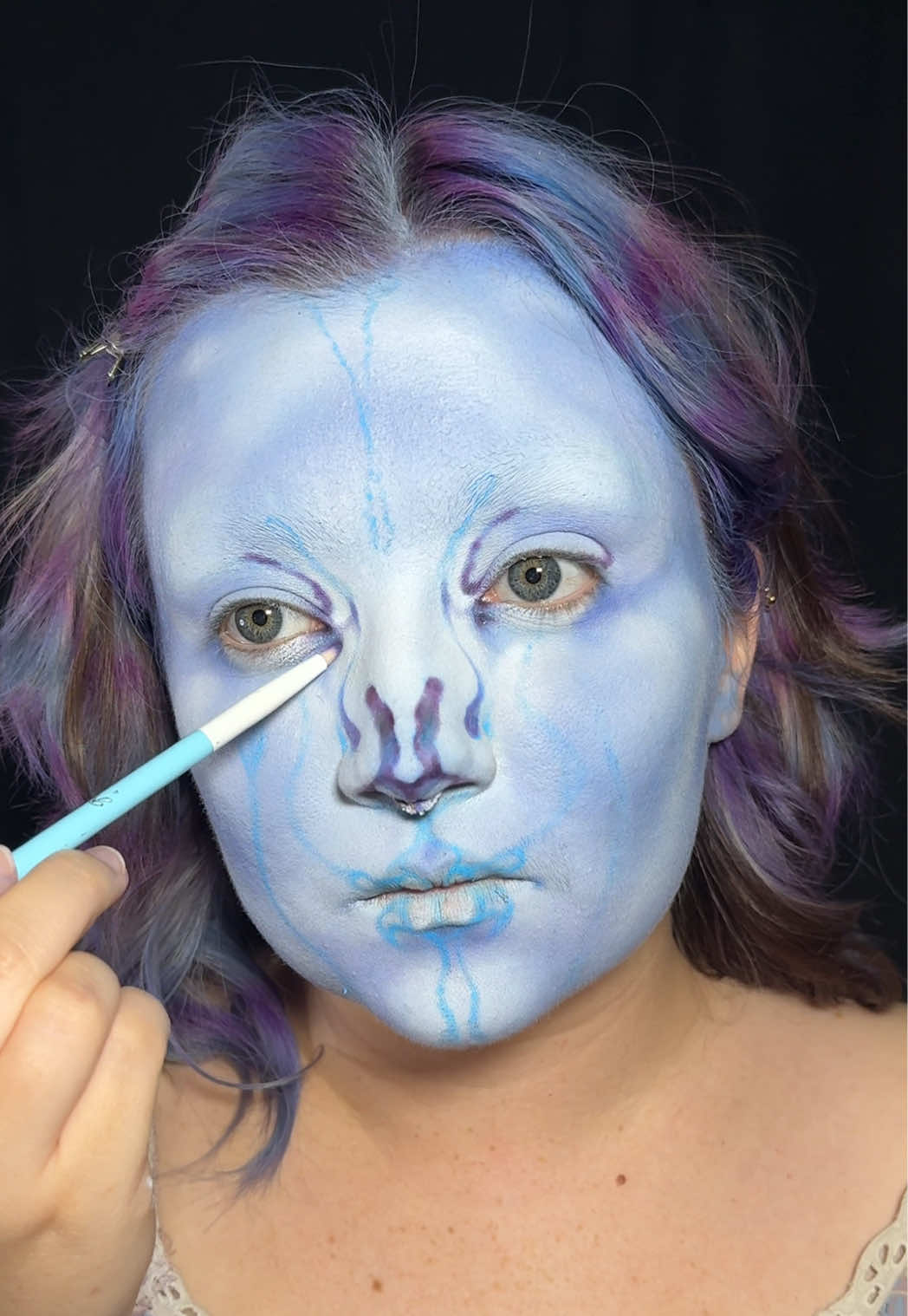 TikTok post by @saph.art for UNIQSO. Caption reads: Mermaid makeup inspired by my hair💙💜 Inspired....