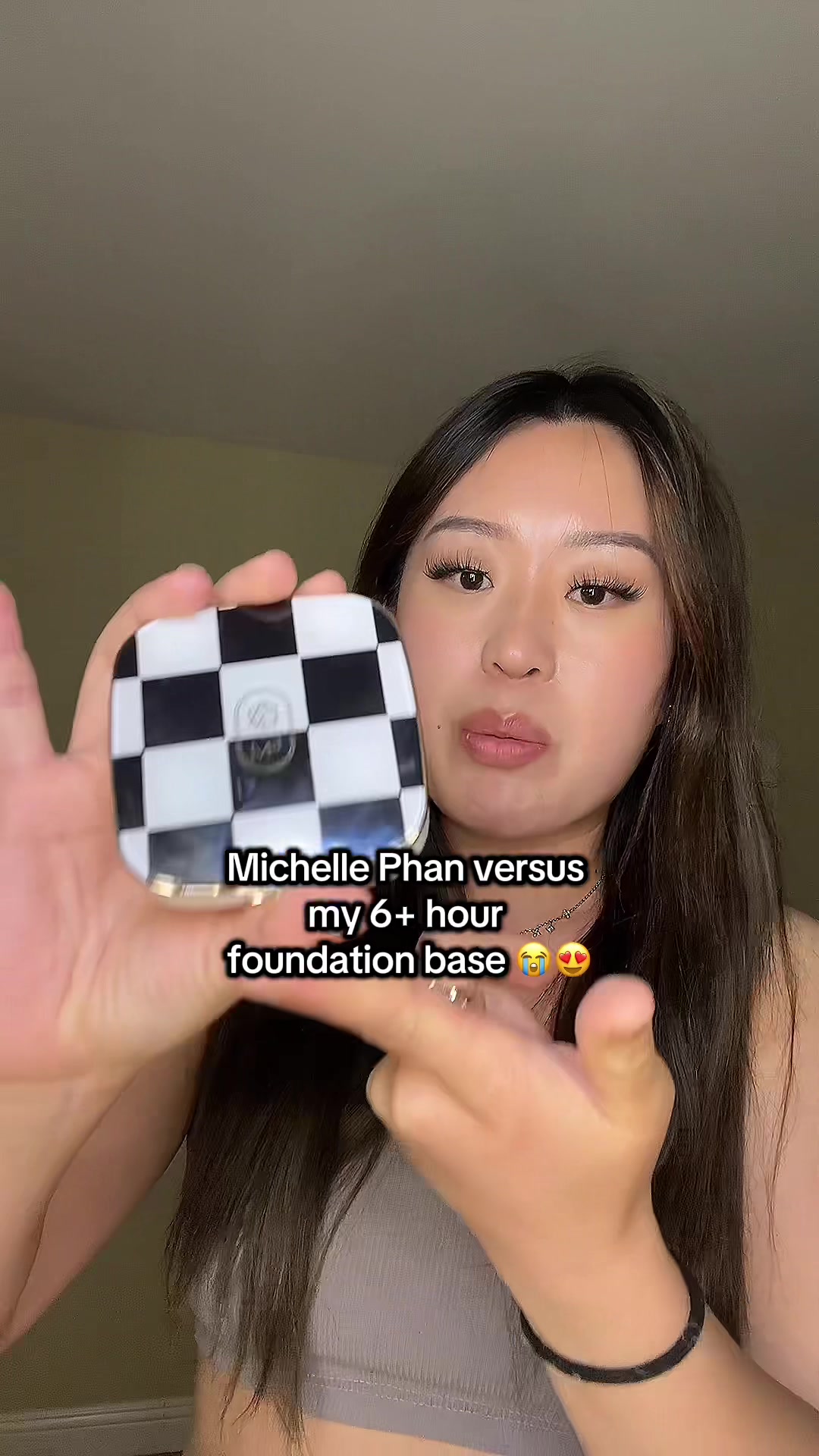 TikTok post by @hotpot.lord for EM Cosmetics. Caption reads: [...] IN PERSON. THIS FORMULA. OH MY GOD. @EM....