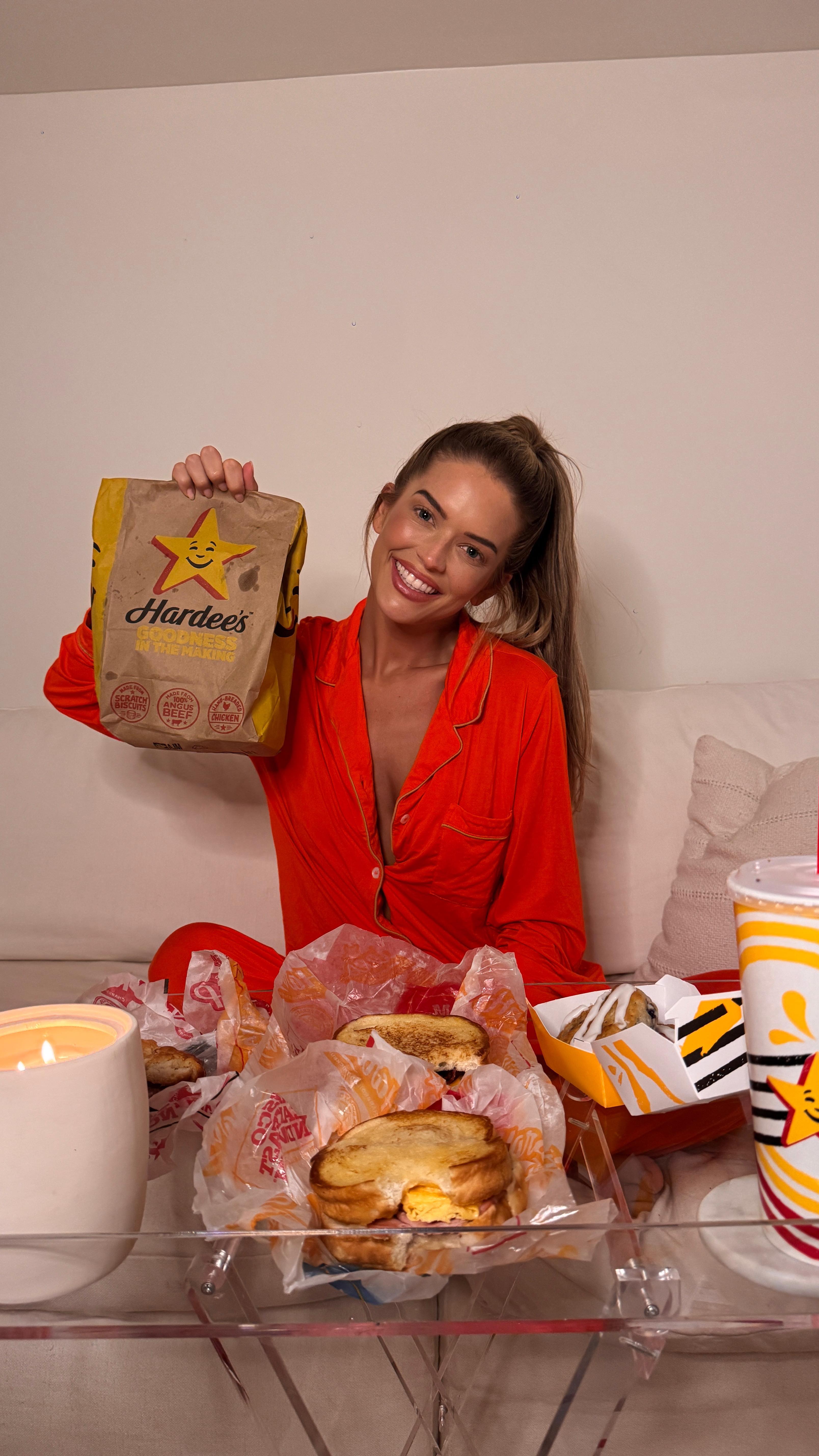 Instagram post by @salleycarson for Hardee's. Caption reads: Crush test: passed ✅
Smoked Sausage Biscuit,....