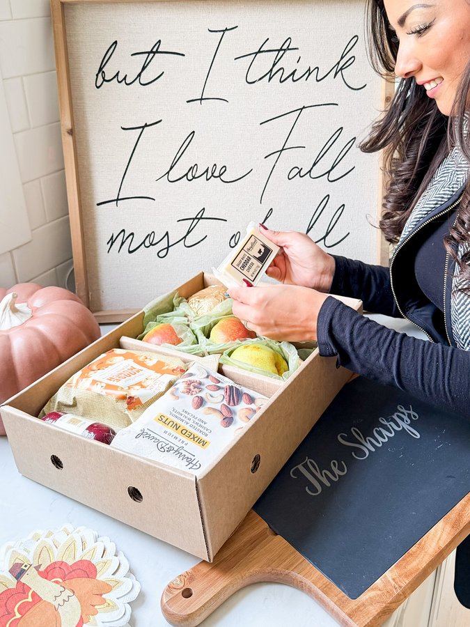 Instagram post by @raisingsharps for Harry & David. Caption reads: #ad Snack boards in our house are a must to slow....