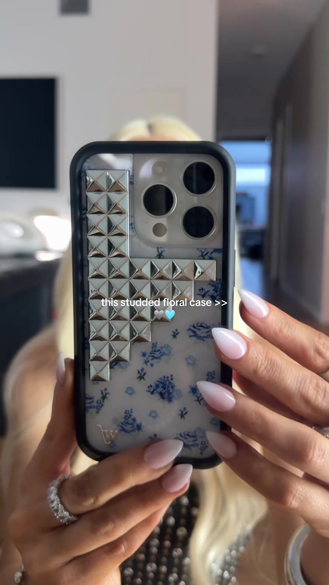 TikTok post by @maes_outfits for Wildflower Cases. Caption reads: [...] silver stud detailing!! I can’t 🩶....