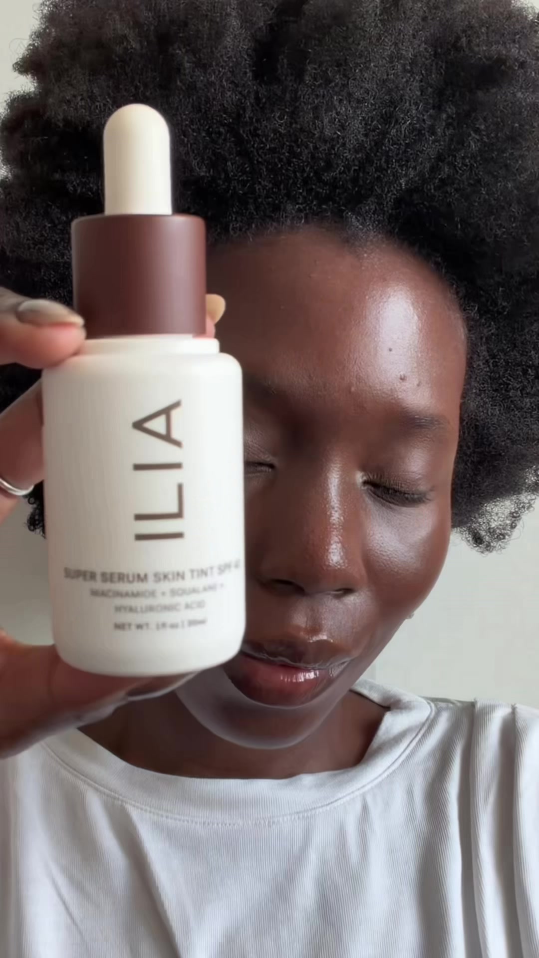 TikTok post by @daniellejinadu for ILIA Beauty. Caption reads: [...] super serum skin tint from @ILIA Beauty....