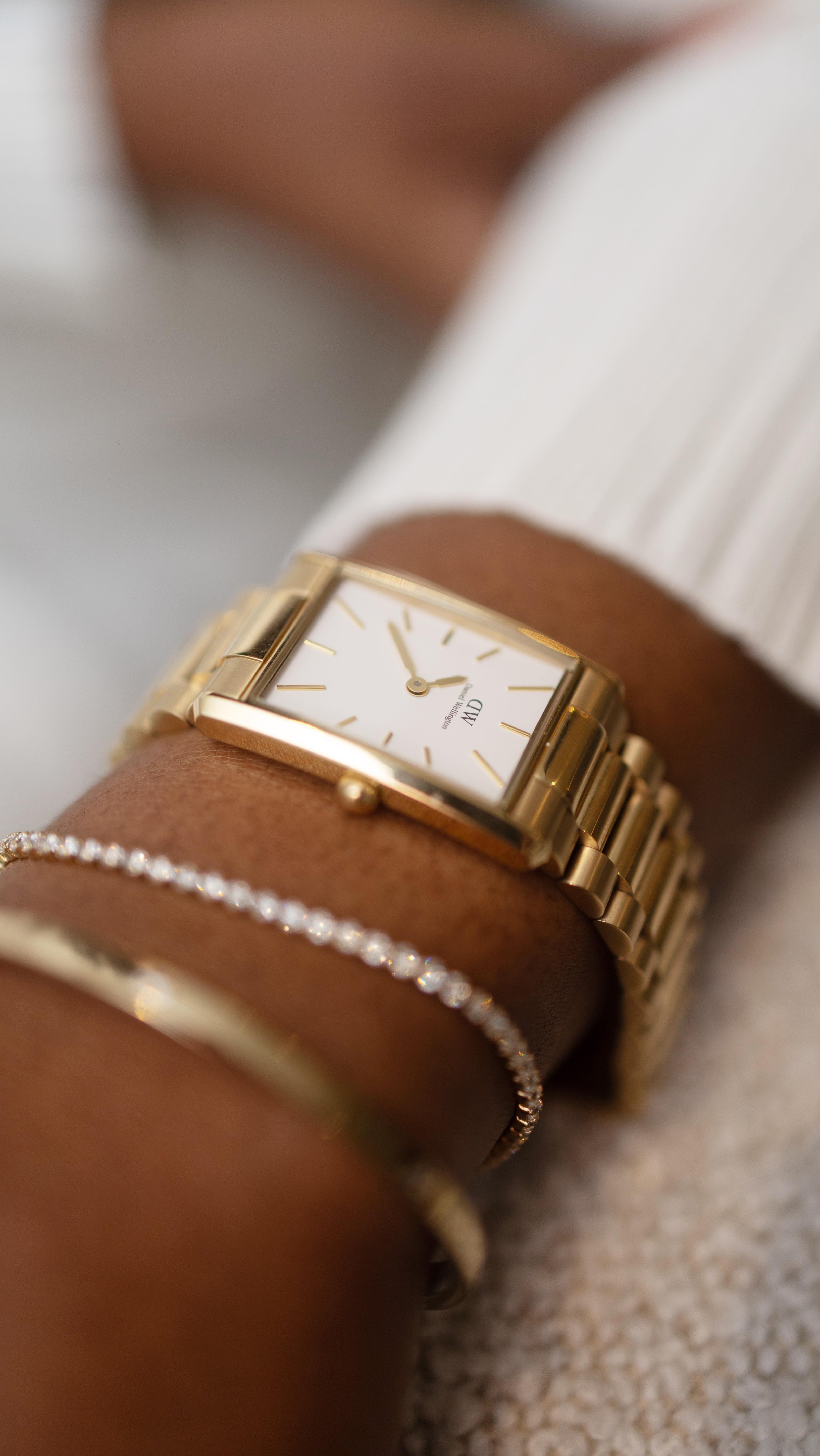 Instagram post by @sine_gugulethu for Daniel Wellington. Caption reads: Help me choose a bag for the @danielwellington....