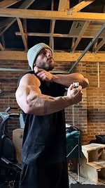 Instagram post by @rossedgley for PhD Nutrition. Caption reads: Bicep ‘sleeper’ build (94kg/207lbs) as we BULK for....