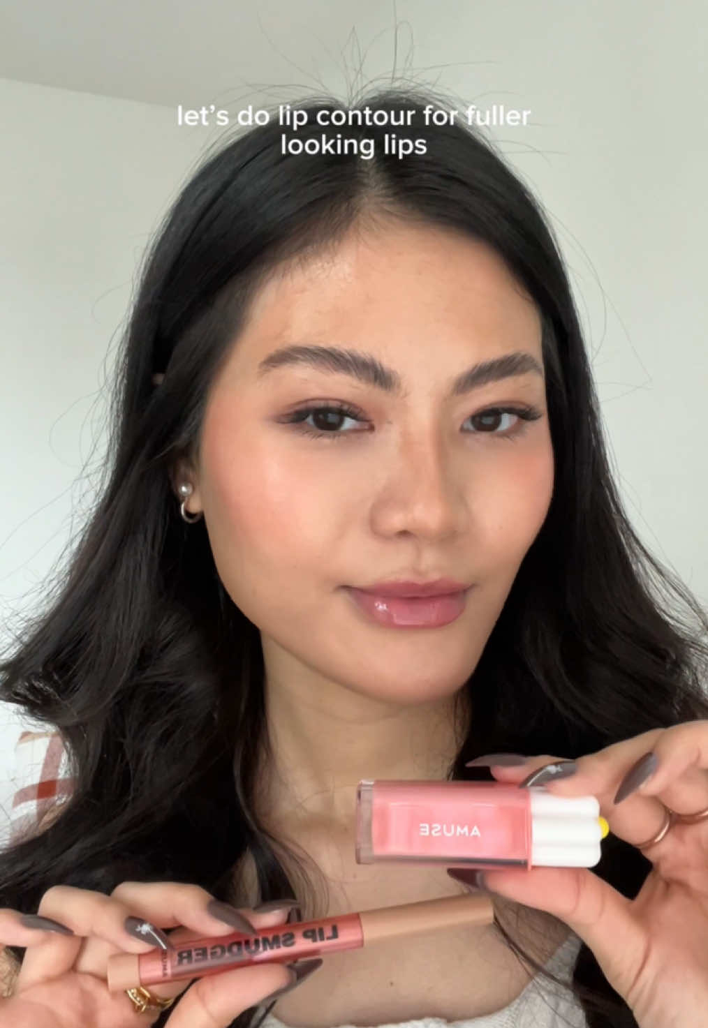 TikTok post by @h0neybuttercups for AMUSE Seoul. Caption reads: @AMUSE Seoul don’t forget to contour your lips 🤗....