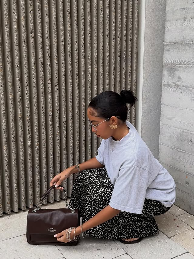 Instagram post by @katjasminee for Coach. Caption reads: Elevated style, everyday ease. Coach always....