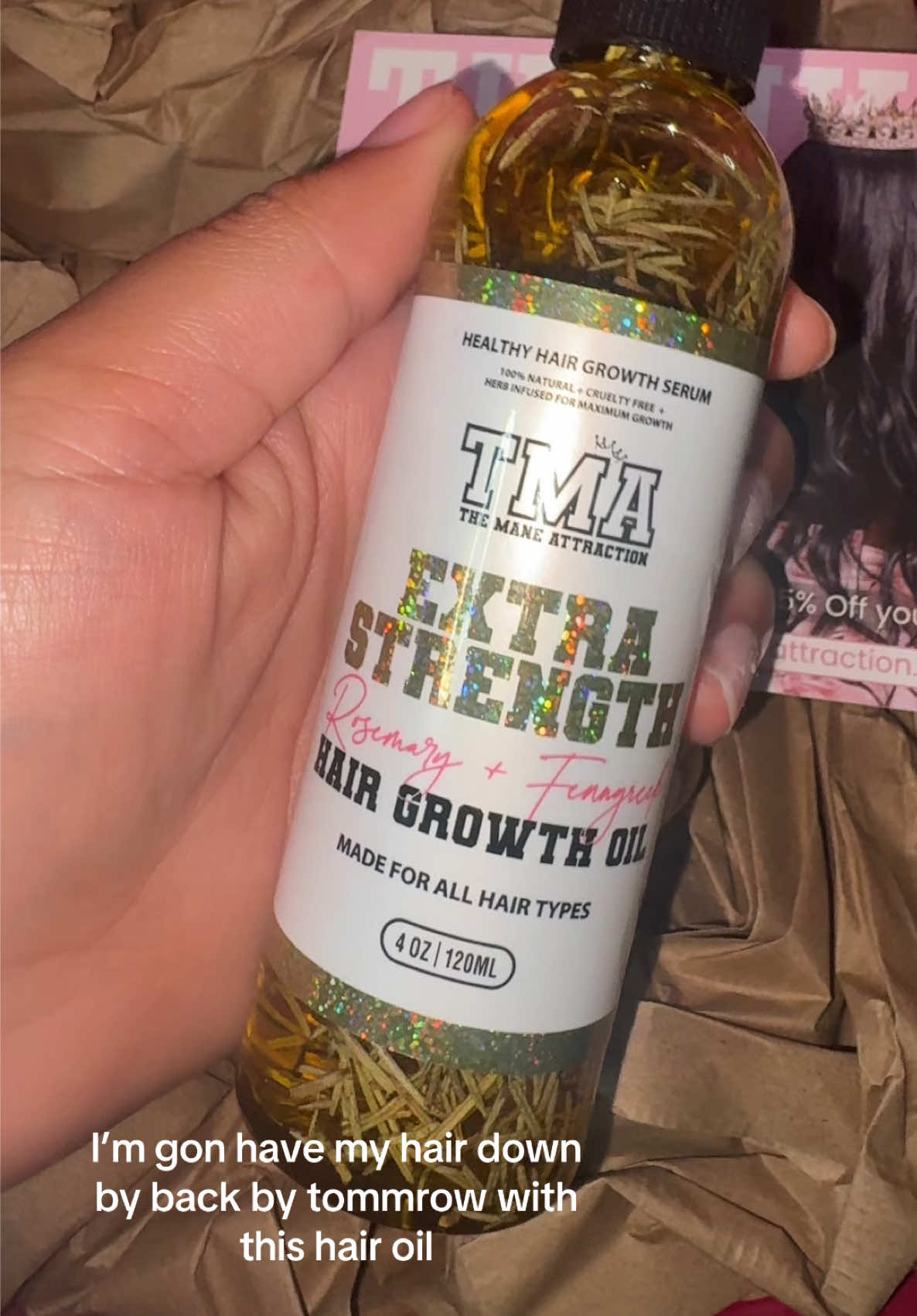 TikTok post by @niasarchieved for The Mane Attraction. Caption reads: @The Mane Attraction#fyp#hairgrowthoil.