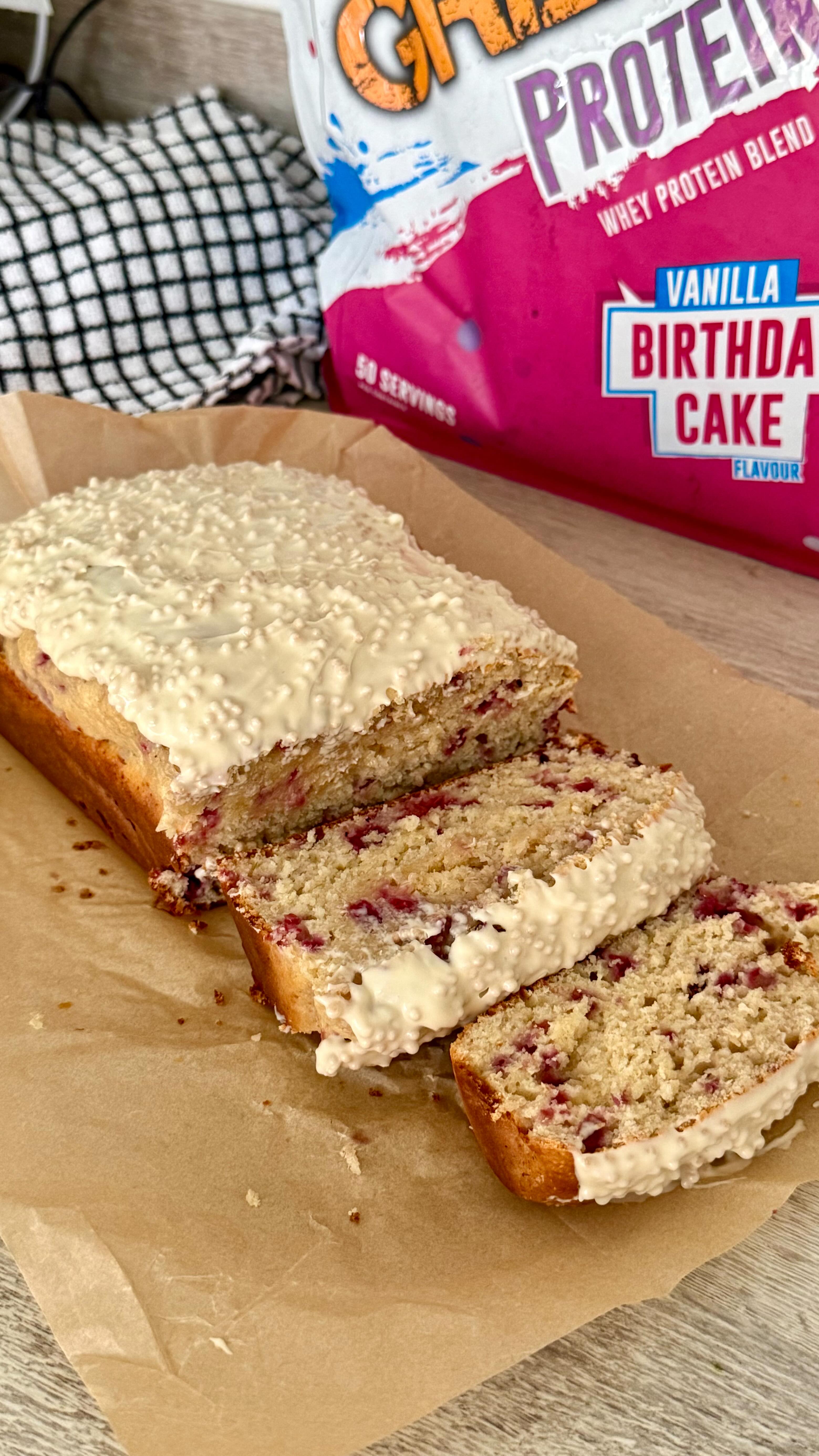 Instagram post by @kirstyfletcher for Grenade. Caption reads: white chocolate raspberry protein loaf cake🍫🍰....