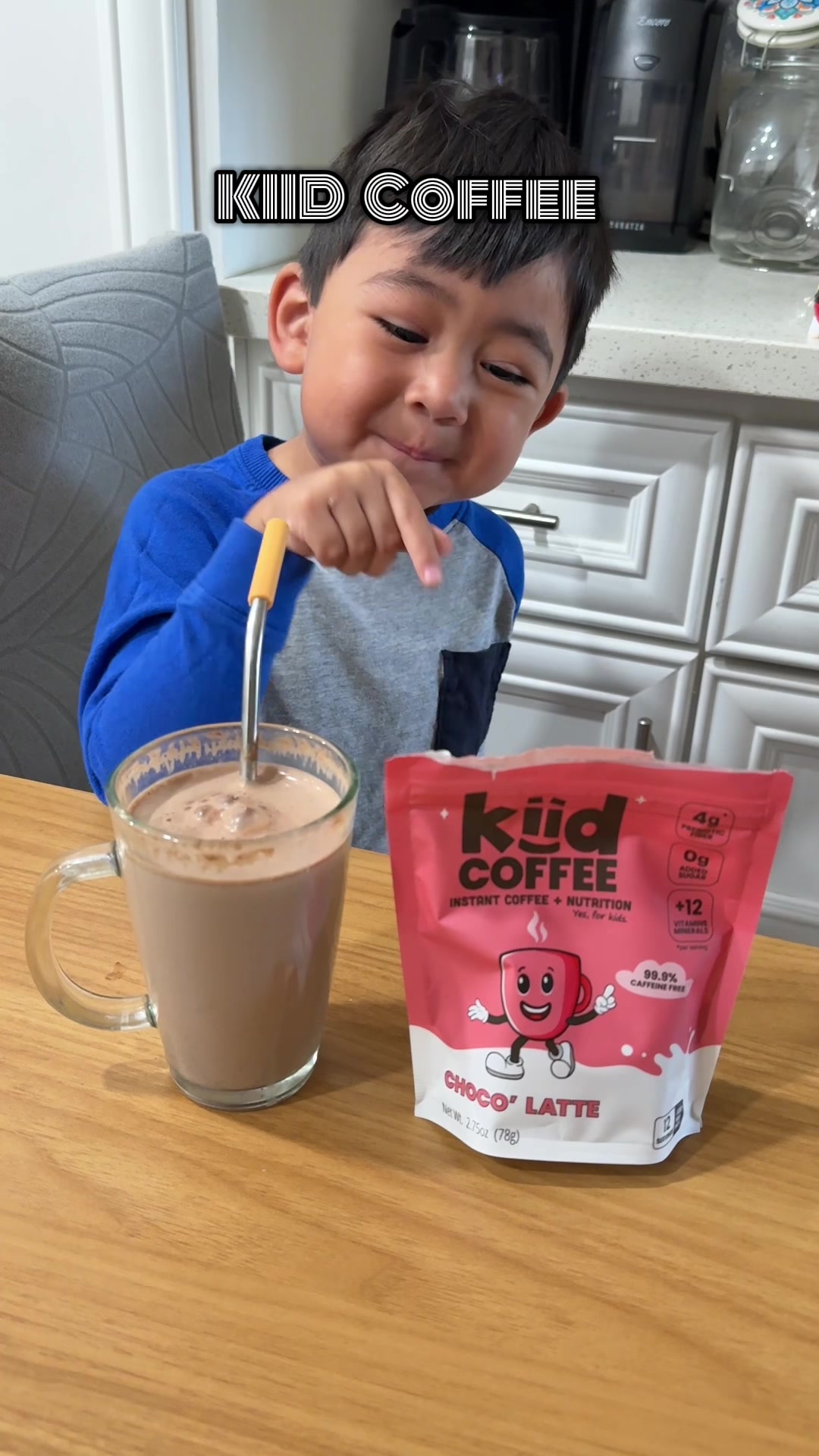 TikTok post by @sandy_vela for Kiid Coffee. Caption reads: Ok this @kiidcoffee is SUPER YUMMY 😋 + my lil one....