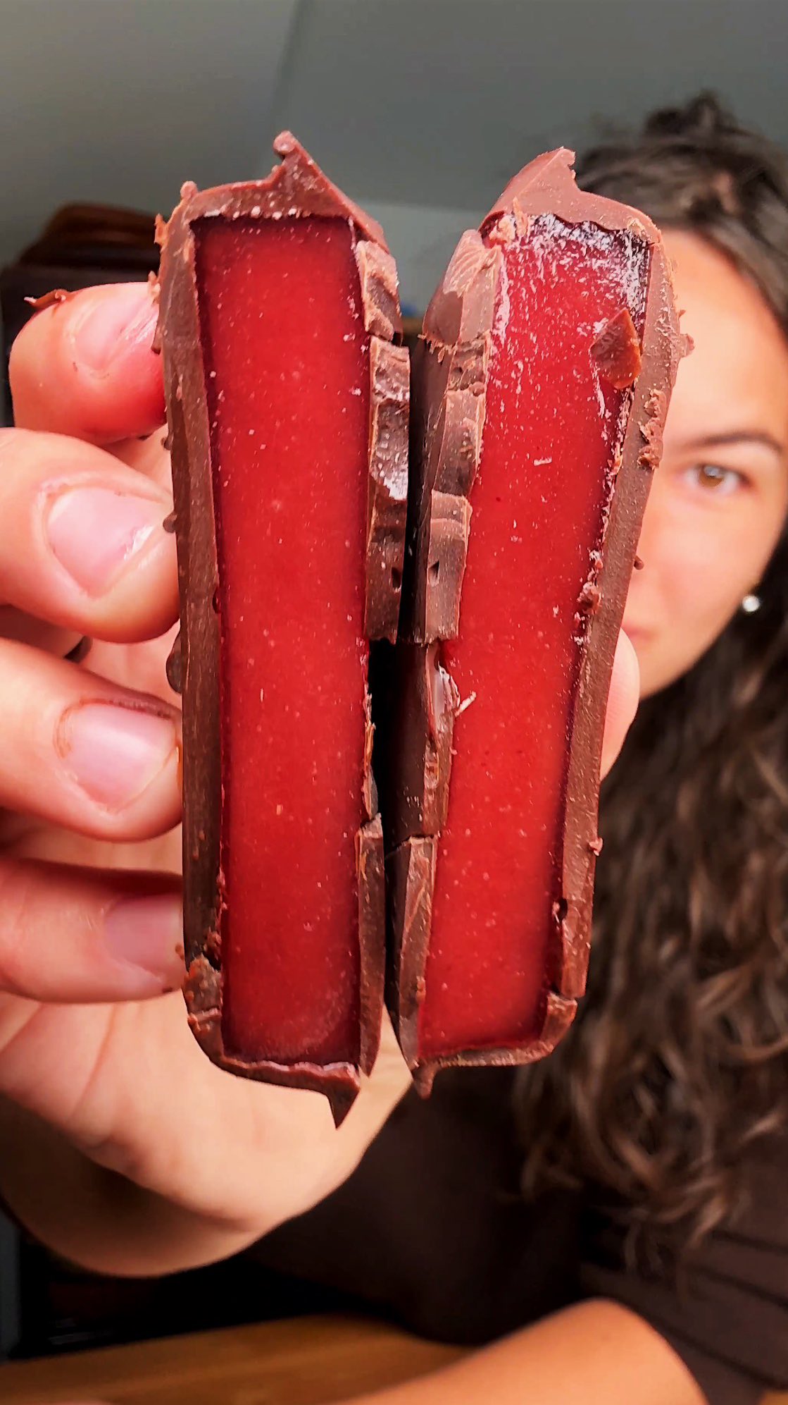 Instagram post by @carolinagelen for NYT Cooking. Caption reads: THREE-INGREDIENT CHOCOLATE CRANBERRY BITES:....