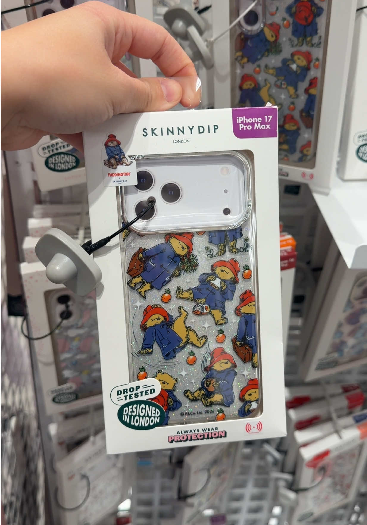 TikTok post by @emmafayedocherty for Skinnydip London. Caption reads: [...] x SkinnyDip Phone Case 🐻 @Skinnydip London....