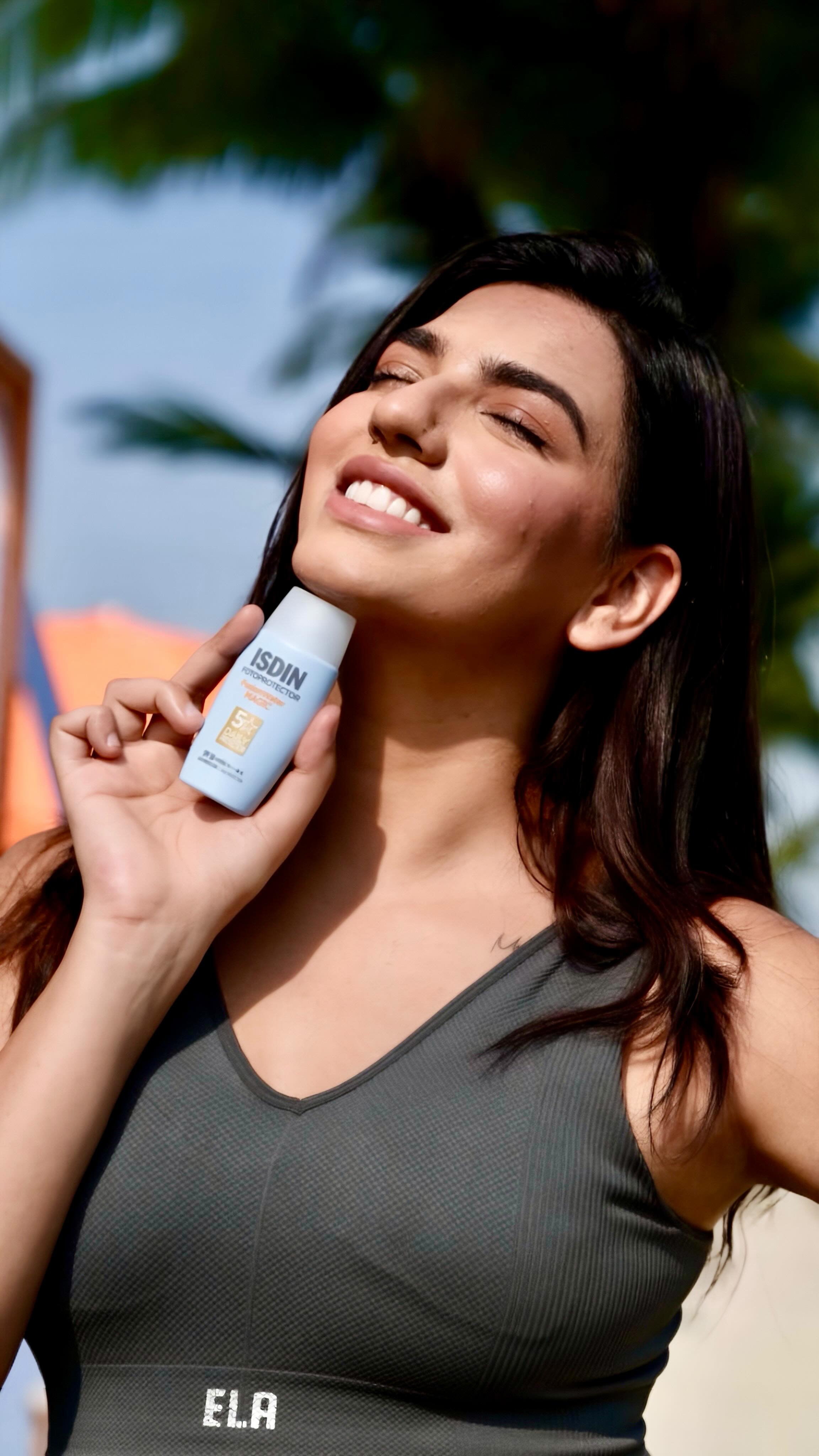 Instagram post by @nikitadhongdi for ISDIN. Caption reads: Sweat-tested ✅
Glow-approved ✅ 
Meet my new SPF....