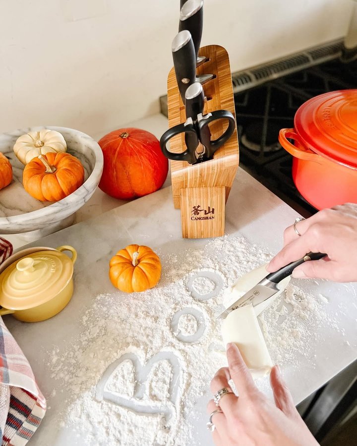 Instagram post by @laura_gaddo for Cangshan Cutlery. Caption reads: Boo! 👻🎃#ad⁠⁠
⁠⁠
Raise your hand if you are....