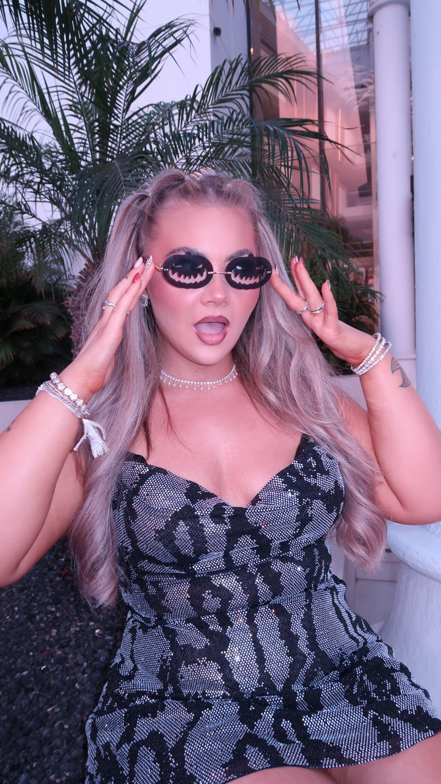 Instagram post by @abigailvancee for OH POLLY. Caption reads: Let’s get dressed for Halloween in Tenerife 🖤....