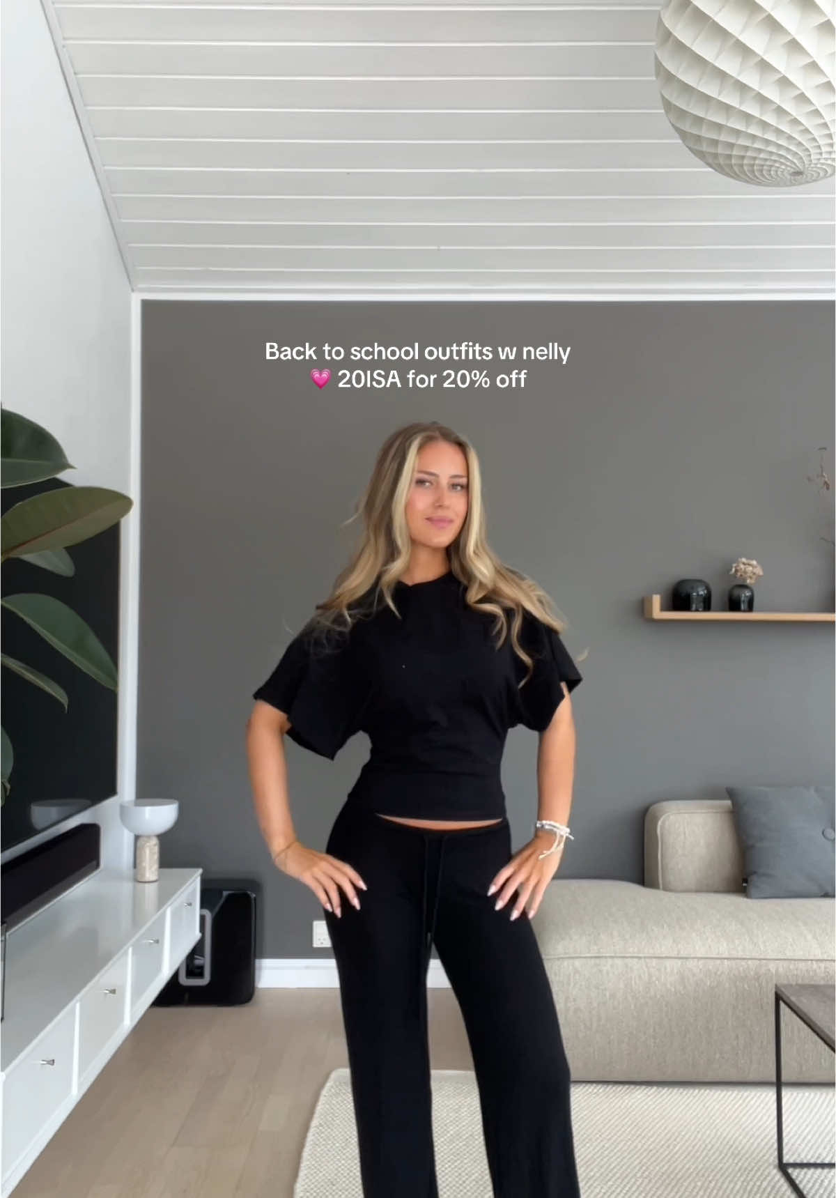 TikTok post by @isachristiansennn for Nelly. Caption reads: Reklame @NELLY.COM 💗 20ISA for 20% off on Nelly....