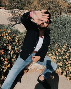 Instagram post by @isthatdann for Teen Vogue. Caption reads: Summer vibes in the heart of our beautiful....