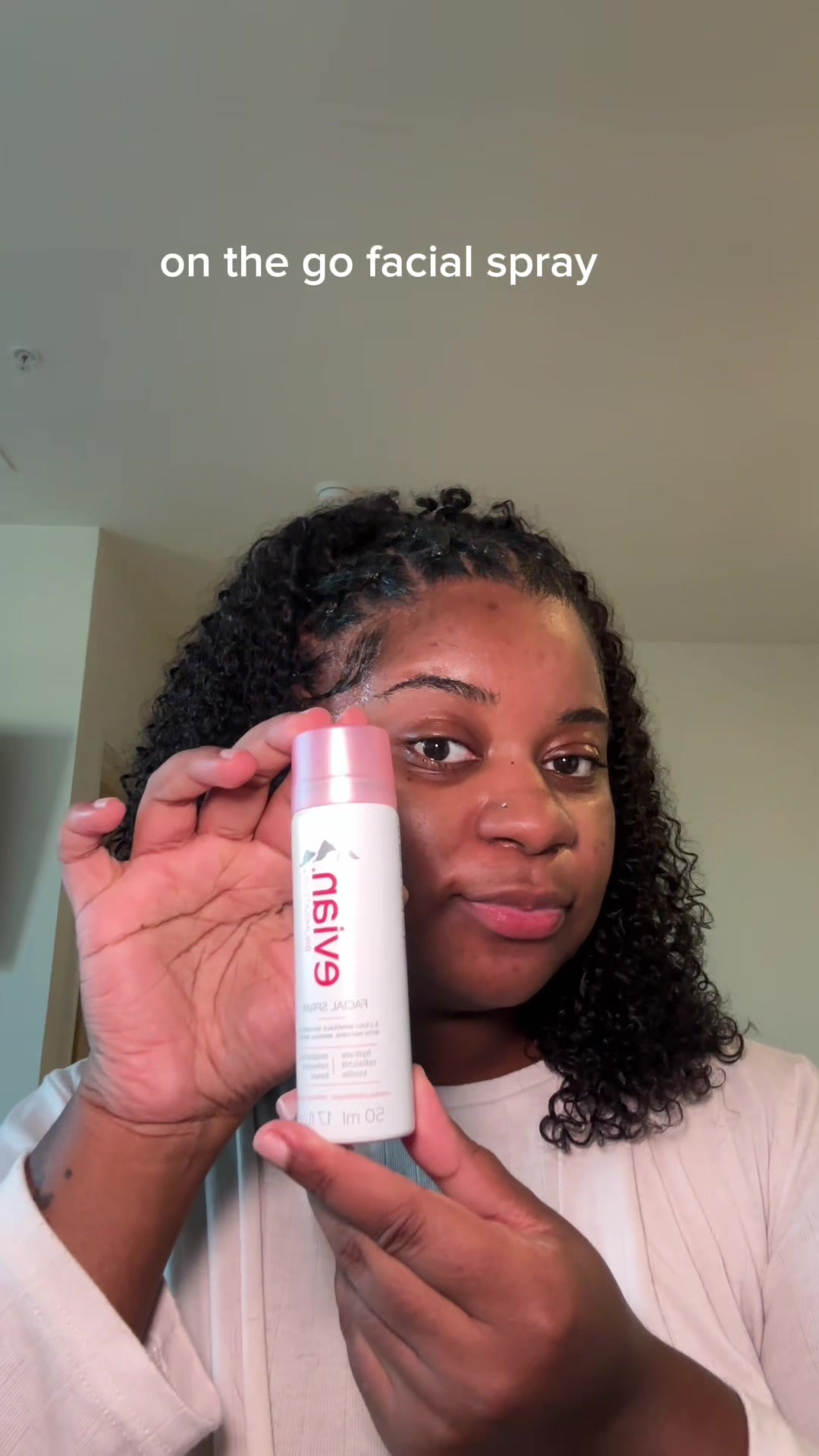 TikTok post by @thechinaelisee for Evian Facial Spray USA. Caption reads: A perfect edition to my skin prep routine from....