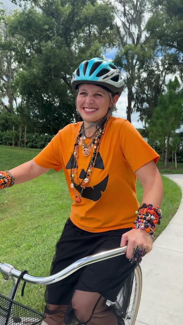 Instagram post by @madison_marilla for Bombas. Caption reads: #bombaspartner Keepin’ it spooky in my new orange....