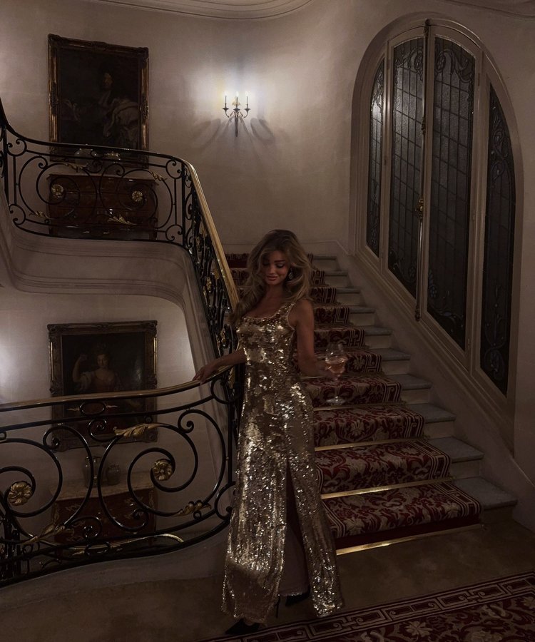 Instagram post by @lauraceliav for Lipsy London. Caption reads: Midnight in Paris, draped in gold🌙✨.