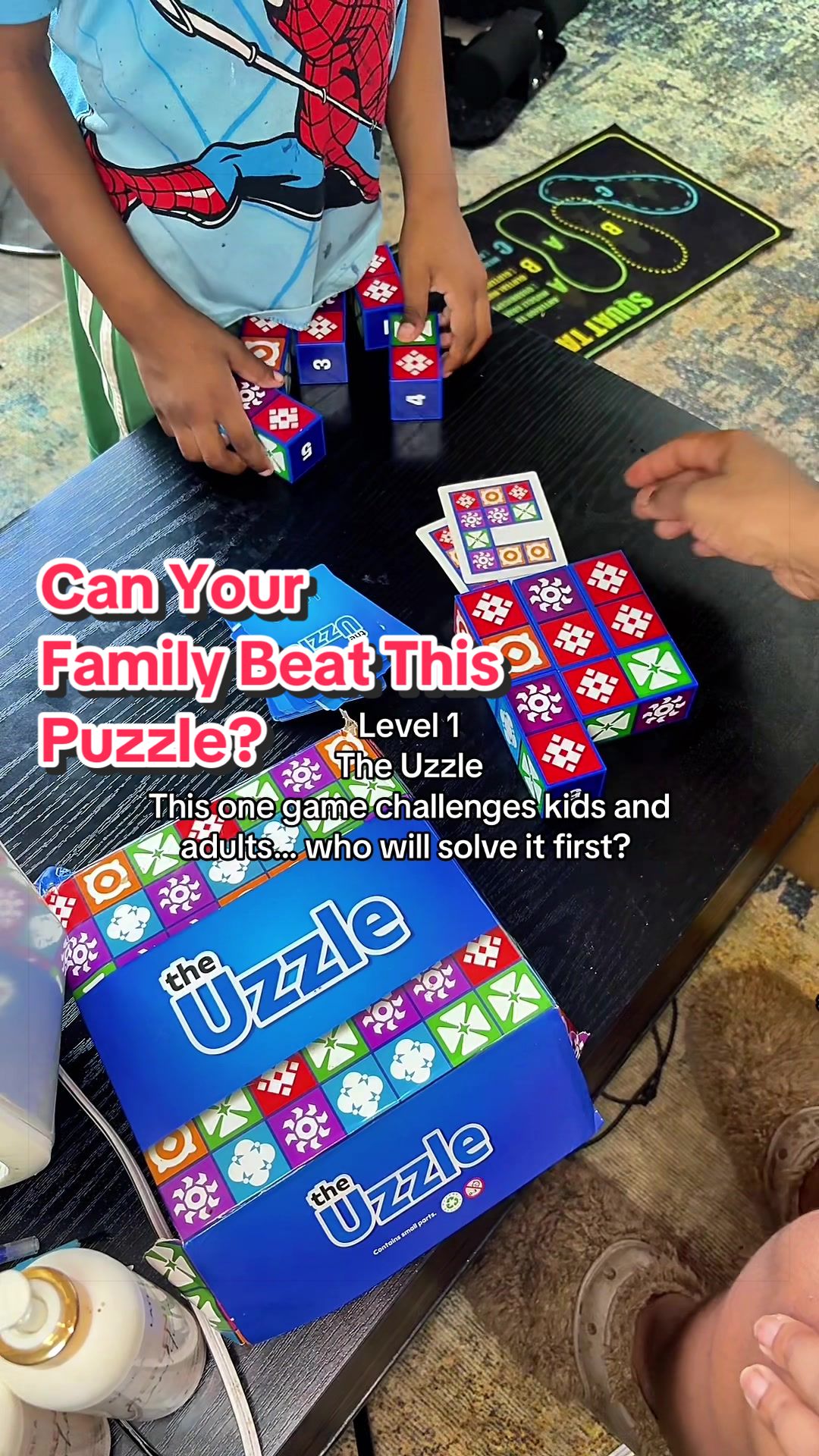 TikTok post by @sweetsuncut for The Uzzle. Caption reads: [...] family will actually want to play? The Uzzle....