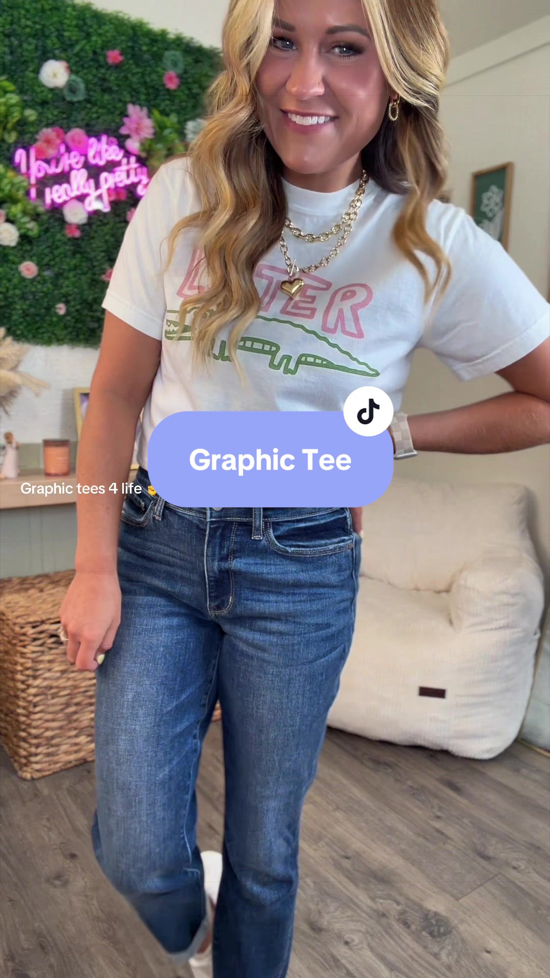 TikTok post by @jackiebentley for Freckled Poppy. Caption reads: Love me a good graphic tee! @Freckled Poppy.