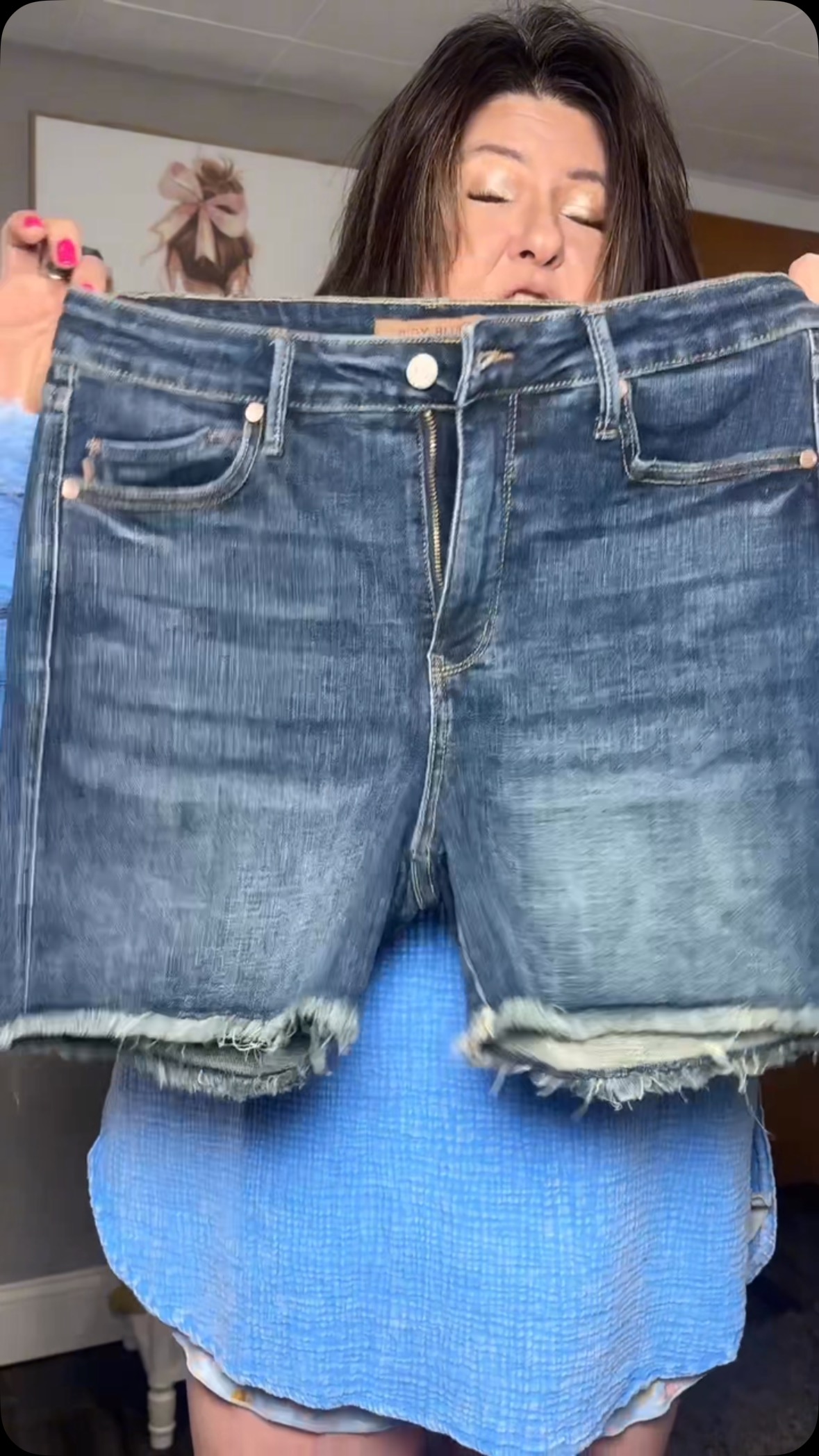 Instagram post by @mamadawnny for Ava Lane Boutique. Caption reads: If you are going to buy any shorts this summer,....