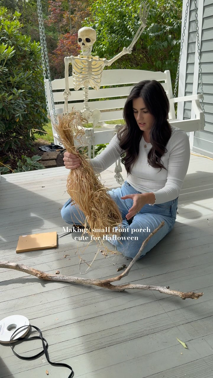 Instagram post by @byhilaryrose for Crate and Barrel. Caption reads: A lot a DIY witches broom made from a tree branch....