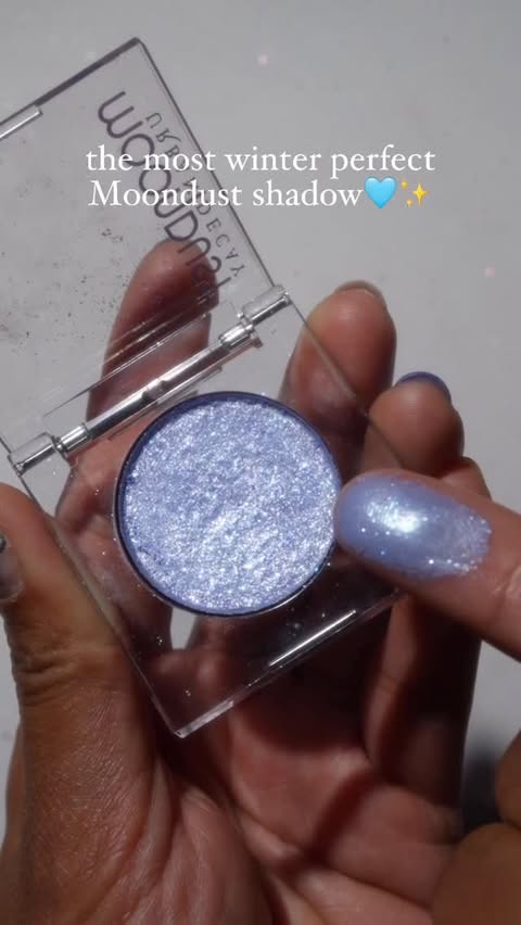 Instagram post by @glamsmitty for Urban Decay. Caption reads: The most winter perfect Moondust shadow🩵✨

Had to....