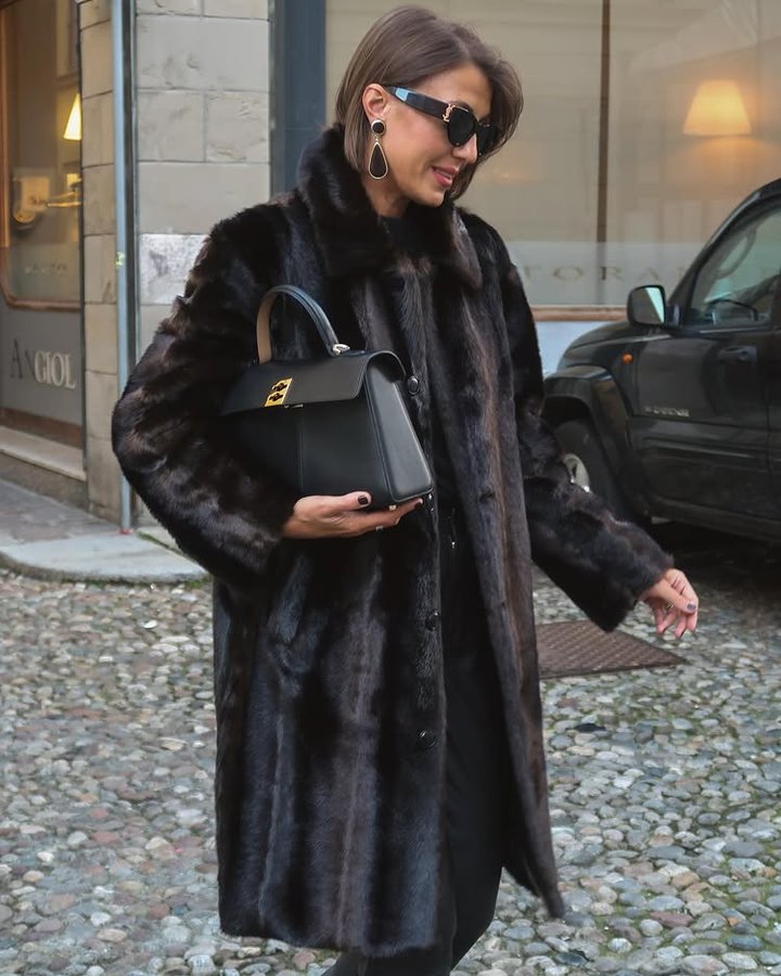 Instagram post by @cristinasurdu for Source Unknown. Caption reads: [...] warm with this FAUX fur coat from....