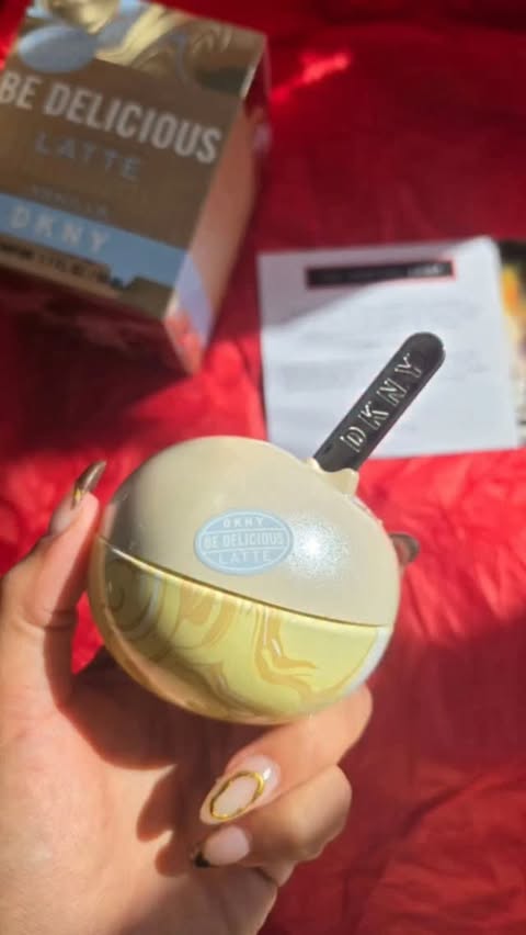 Instagram post by @elizabeth_rebecca_twins2020 for The Perfume Shop. Caption reads: [...] for on repeat. #dknylattecollection....