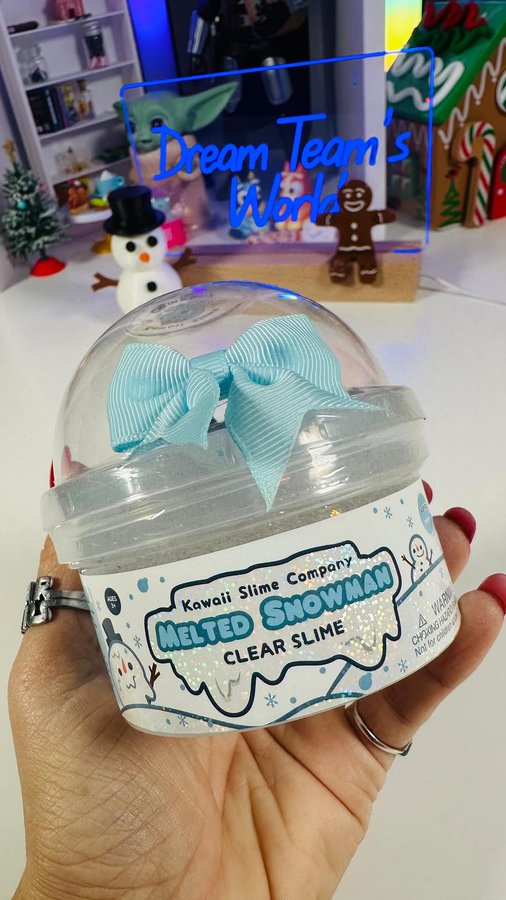 Instagram post by @dreamteamsworld for Kawaii Slime Company. Caption reads: Melted Snowman ⛄️ Clear Slime #slime #asmr #gifted.