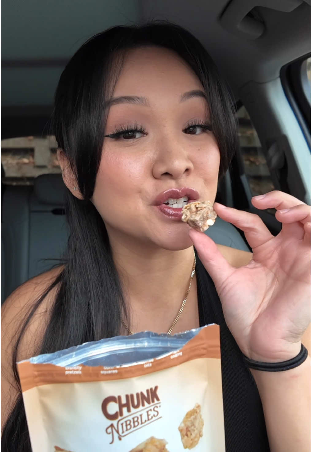 TikTok post by @trinhdoesthings for Chunk Nibbles. Caption reads: This new toffee flavor of @Chunk Nibbles is....