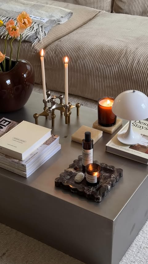 Instagram post by @deanikollaj for BYREDO. Caption reads: Your coffee table isn’t boring, it just needs some....