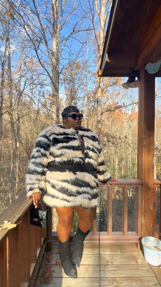 Instagram post by @keziakswift for ELOQUII. Caption reads: Help the Bear @eloquii 

Black & White Faux Fur....