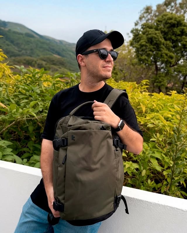 Instagram post by @mrjasonsantos for Tomtoc. Caption reads: [...] Travel lighter. Enjoy the journey. ✨....