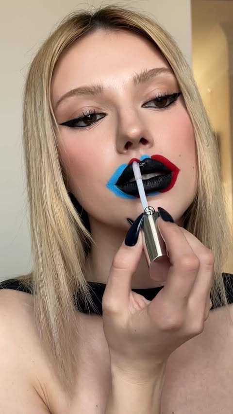 Instagram post by an influencer for Armani beauty. Caption reads: [...] lipstick in R127 carminio @armanibeauty....