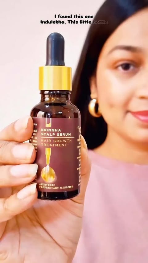 Instagram post by @rajput_khaleesi for Indulekha. Caption reads: [...] baby hair loves this 100% ayurvedic serum.....