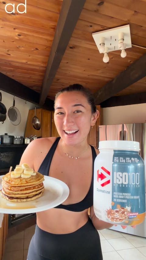 Instagram post by @sally.cohen for Dymatize. Caption reads: [...] protein banana pancakes powered by @dymatize.