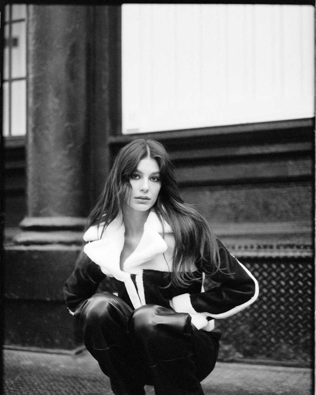Instagram post by @camilamorrone for DKNY. Caption reads: my heart belongs to you, NYC🖤 @dkny #IFEELDKNY....