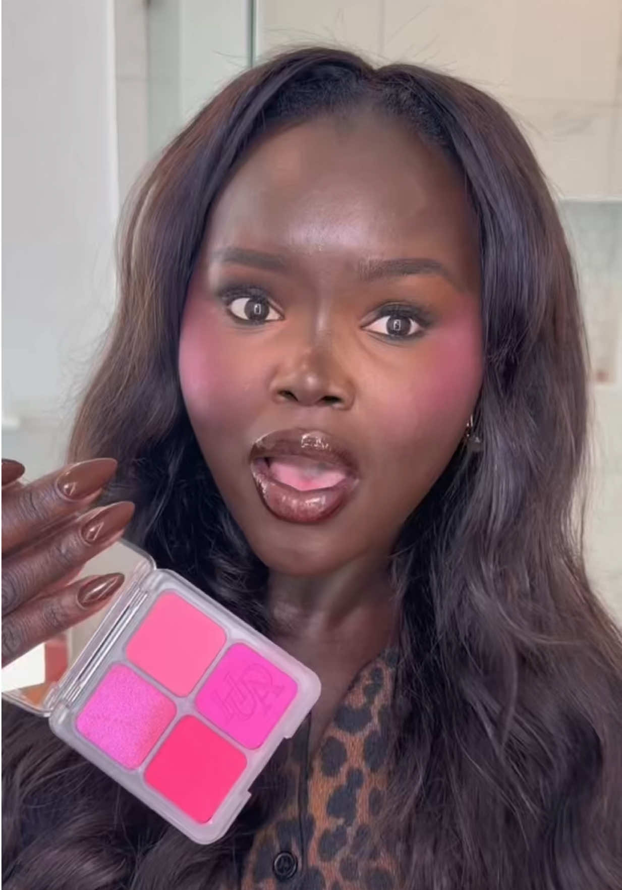 TikTok post by @dollievision for Huda Beauty. Caption reads: Trying the new @Huda Beauty baby pink blush… is....