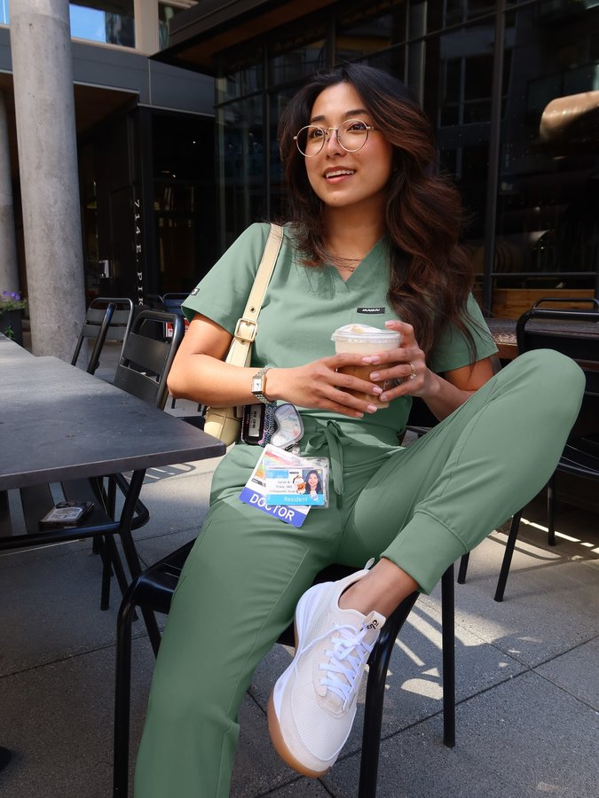 Instagram post by @sarahpirklemd for Jaanuu. Caption reads: pre-shift coffee run in my new @jaanuu sage set!....