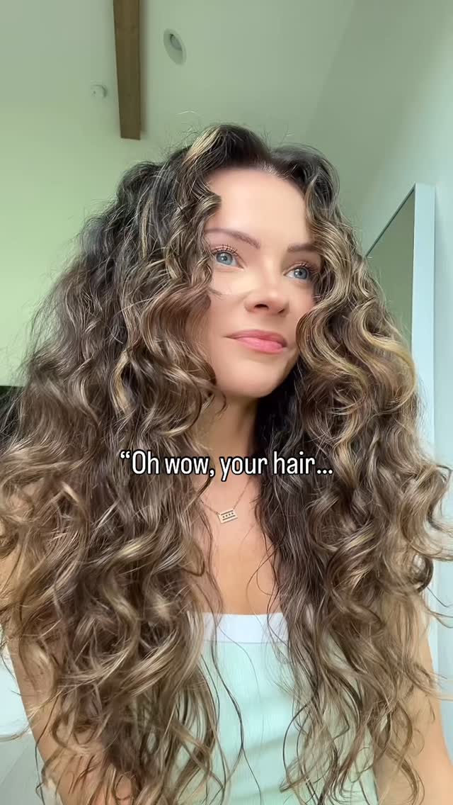 Instagram post by @wavycurly for Ouidad. Caption reads: [...] Bounce Curl Ayurvedic Deep Conditioner
➰....