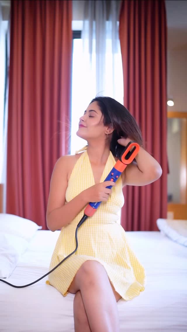 Instagram post by @joyeetabanerjee11 for Dyson. Caption reads: Curly, swirly, and oh-so-dreamy 💫 Just a twist, a....