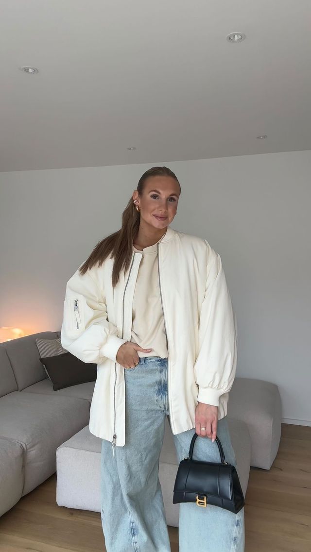 Instagram post by @sarahklefisch for Hernameis. Caption reads: ootd 7/30 💫 

Sweater @hernameisthelabel 
Jeans....