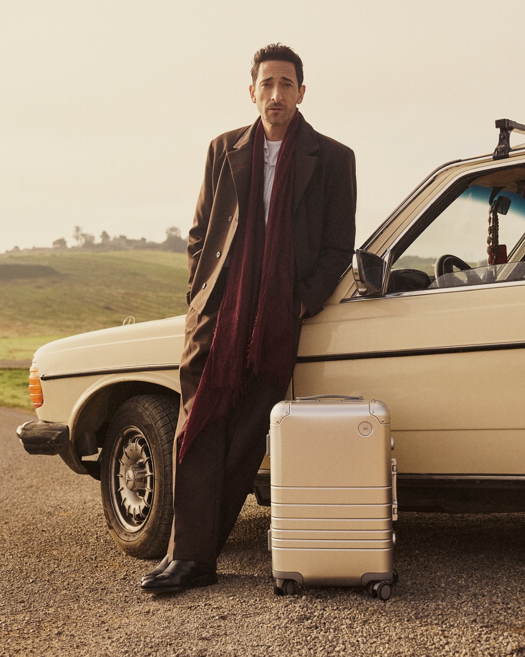 Instagram post by @adrienbrody for Monos. Caption reads: Introducing The Aluminum Collection by....