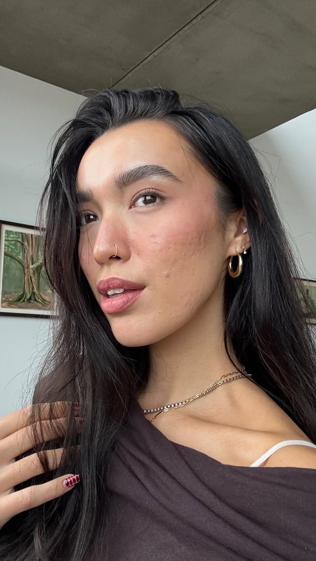 Instagram post by @evajan.x for Astrid & Miyu. Caption reads: this is your sign to get a piercing in London,....